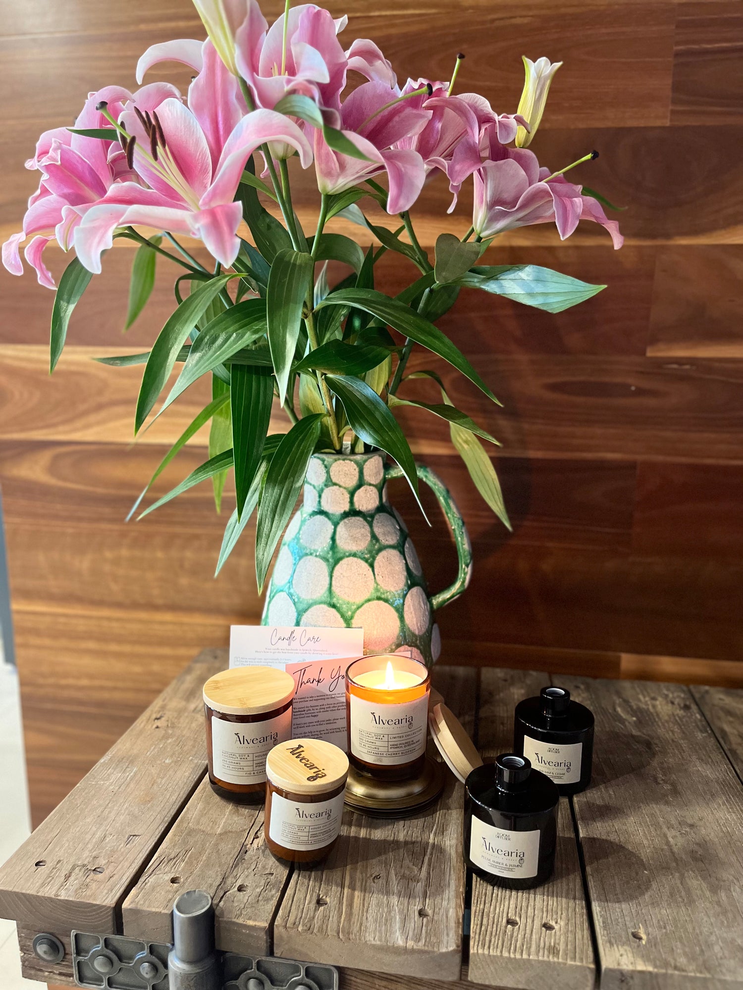 Image of Natural Wax Candles, Reed Stick Diffusers with Lillies in the Background