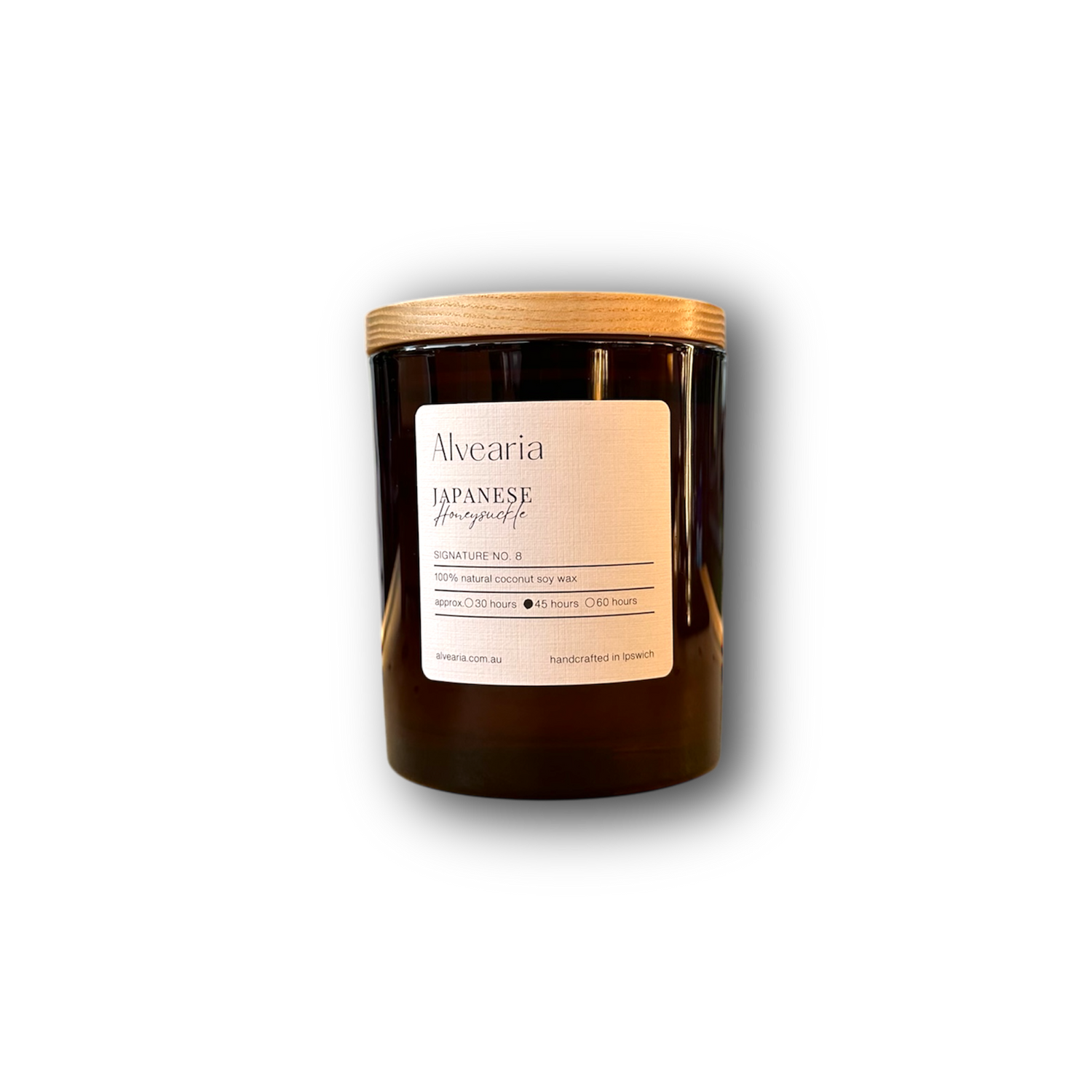 hand-poured soy candle in amber glass jar