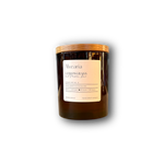 hand-poured soy candle in amber glass jar