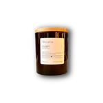 hand-poured soy candle in amber glass jar