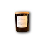 hand-poured soy candle in amber glass jar