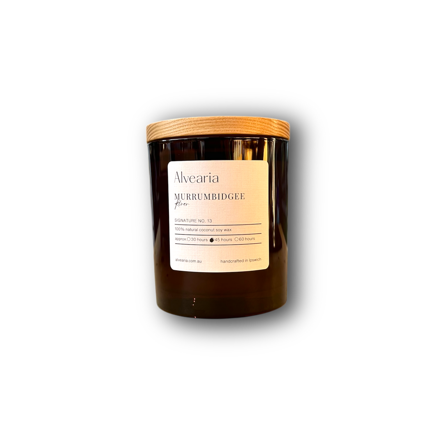 hand-poured soy candle in amber glass jar