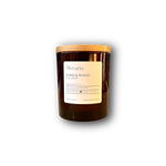 hand-poured soy candle in amber glass jar