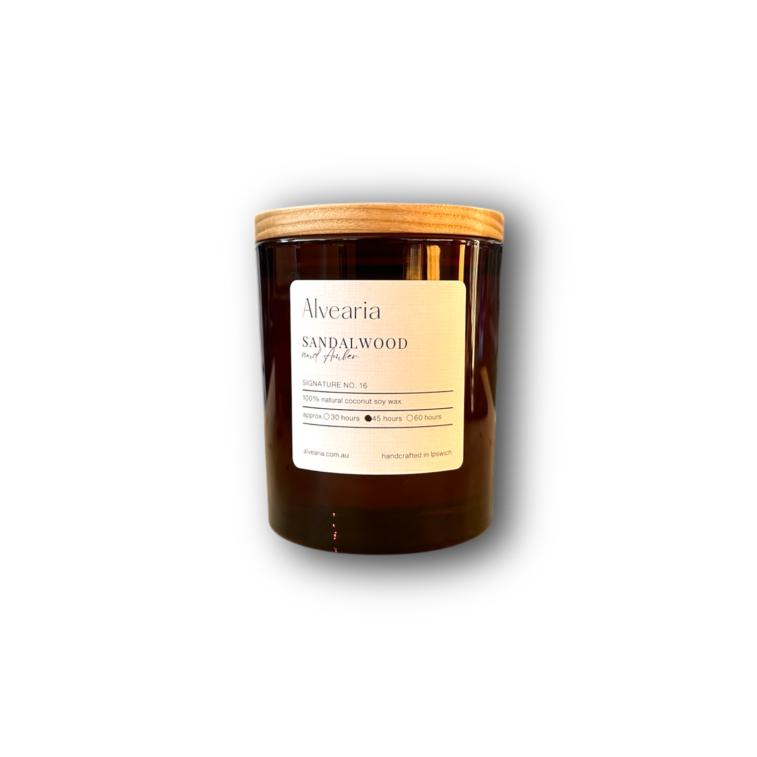 hand-poured soy candle in amber glass jar