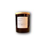 hand-poured soy candle in amber glass jar